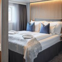 Außenkabine Deluxe Schlafbereich © Havila Kystruten Johan Holmquist